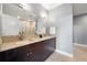 Well-lit bathroom featuring a double vanity with granite countertops and a large mirror at 905 Juniper Ne St # 708, Atlanta, GA 30309