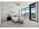 Bright bedroom featuring large windows, a ceiling fan, and a sitting area at 905 Juniper Ne St # 708, Atlanta, GA 30309