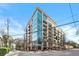 Modern building showcasing a sleek design, with floor-to-ceiling windows and street-level shops at 905 Juniper Ne St # 708, Atlanta, GA 30309