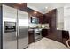 Modern kitchen boasts stainless steel appliances and sleek, dark wood cabinetry at 905 Juniper Ne St # 708, Atlanta, GA 30309