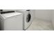 Bright laundry room includes a washer and dryer and marble flooring at 905 Juniper Ne St # 708, Atlanta, GA 30309