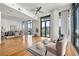 Bright open living area with hardwood floors, neutral decor, and many windows at 905 Juniper Ne St # 708, Atlanta, GA 30309