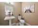 Charming powder room with pedestal sink, modern toilet, and stylish decor at 905 Juniper Ne St # 708, Atlanta, GA 30309