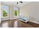 Bright Bedroom with hardwood floors, large windows, and a cozy crib creates a warm space at 1106 Briar Cove Cir, Atlanta, GA 30329