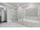 The main bathroom has a soaking tub, glass shower, and tile accents, perfect for relaxation at 1106 Briar Cove Cir, Atlanta, GA 30329