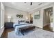 The main bedroom includes a sitting area and decorative touches creating an inviting retreat at 1106 Briar Cove Cir, Atlanta, GA 30329
