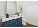 Chic powder room showcases a marble countertop, silver framed mirror, and contemporary fixtures at 1106 Briar Cove Cir, Atlanta, GA 30329