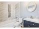 Updated bathroom showcasing tiled walls, new fixtures, and modern vanity at 3187 Abbeywood Dr, Decatur, GA 30034
