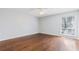Bright bedroom featuring hardwood floors, ceiling fan and decorative window at 3187 Abbeywood Dr, Decatur, GA 30034
