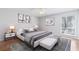 Staged bedroom featuring hardwood floors, area rug and natural light at 3187 Abbeywood Dr, Decatur, GA 30034