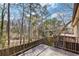 View from a deck with metal railing and tall trees in the background at 3187 Abbeywood Dr, Decatur, GA 30034