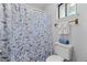 Updated bathroom features a butterfly shower curtain and modern fixtures at 3193 Deshong Dr, Stone Mountain, GA 30087
