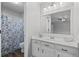 Bright bathroom featuring new vanity, updated fixtures, and a shower/tub combo at 3193 Deshong Dr, Stone Mountain, GA 30087