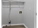Neutral-colored laundry room with washer hookups and new flooring at 3193 Deshong Dr, Stone Mountain, GA 30087