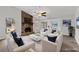 Bright living room features a stone fireplace and ample seating, virtually staged to enhance its appeal at 3193 Deshong Dr, Stone Mountain, GA 30087