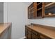 Wet bar features wooden cabinets, a sink, and ample counter space at 3193 Deshong Dr, Stone Mountain, GA 30087