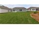 Expansive backyard features lush lawn, backing up to neighboring homes at 401 Village Ln, Fairburn, GA 30213