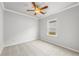 A cozy bedroom features neutral walls, carpet, and a bright window at 401 Village Ln, Fairburn, GA 30213