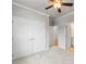 Bedroom featuring neutral walls, carpet, with closet and doorway to bathroom with vanity at 401 Village Ln, Fairburn, GA 30213