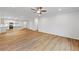 Inviting living space with open kitchen and dining, wood floors, neutral paint, and recessed lighting at 401 Village Ln, Fairburn, GA 30213