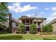 Expansive backyard showcasing a multi-level deck, lush lawn, and mature trees at 5025 Savannah Run, Cumming, GA 30040
