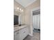 Clean bathroom with granite vanity and white cabinets at 5025 Savannah Run, Cumming, GA 30040