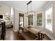 Cozy breakfast nook featuring a wood table, bench seating, and natural light at 5025 Savannah Run, Cumming, GA 30040