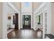 Elegant foyer with dark hardwood floors and a soaring two-story ceiling with large windows at 5025 Savannah Run, Cumming, GA 30040