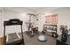 Home gym with treadmill, Bowflex, weights, and rubber flooring for a great workout space at 5025 Savannah Run, Cumming, GA 30040