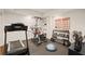 Basement gym equipped with fitness equipment, including a treadmill and Bowflex system, for convenient at-home workouts at 5025 Savannah Run, Cumming, GA 30040
