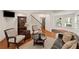 Open living space with hardwood floors, neutral decor, and ample natural light creates a warm, inviting atmosphere at 5025 Savannah Run, Cumming, GA 30040