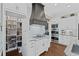 Butler's pantry featuring ample shelving space and stainless steel appliances and lighting at 5025 Savannah Run, Cumming, GA 30040