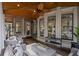 Inviting covered porch with comfortable seating, a ceiling fan, and a relaxing ambiance at 5025 Savannah Run, Cumming, GA 30040