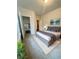 A bedroom with an ensuite bath and walk-in closet, designed for relaxation at 1147 Halletts Peak Pl, Lawrenceville, GA 30044