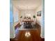 Bright dining room with a decorative table and seating for six at 1147 Halletts Peak Pl, Lawrenceville, GA 30044