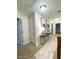A well lit hallway with artwork and doors leading to other rooms at 1147 Halletts Peak Pl, Lawrenceville, GA 30044