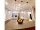 Stylish living room featuring modern lighting, a fireplace, and built-in bookshelves at 1147 Halletts Peak Pl, Lawrenceville, GA 30044