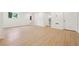 Spacious finished basement with hardwood floors, white walls, and access to other rooms at 1667 Atherton Cir, Decatur, GA 30035