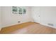 Cozy bedroom featuring hardwood floors, neutral walls, and a bright window at 1667 Atherton Cir, Decatur, GA 30035