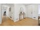 Inviting entryway with light wood floors, white walls, and a simple console table with decorative accents at 1667 Atherton Cir, Decatur, GA 30035