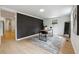 Office space boasts a stylish accent wall, modern desk, and ample natural light at 1667 Atherton Cir, Decatur, GA 30035