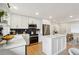 Updated kitchen with an island, stainless steel appliances, and a modern design that blends seamlessly with living spaces at 1667 Atherton Cir, Decatur, GA 30035
