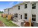 Rear exterior view of home featuring fenced yard, patio, and seating area at 316 Navigator Ln, Mcdonough, GA 30253