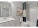 Bathroom with a vanity, mirror and combination tub and shower with a decorative curtain at 316 Navigator Ln, Mcdonough, GA 30253
