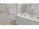 Bathroom featuring double sinks with stunning countertop and modern fixtures at 316 Navigator Ln, Mcdonough, GA 30253