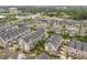Aerial view of a well-planned neighborhood with shopping, dining, green spaces and a variety of modern townhomes at 392 Concord St, Alpharetta, GA 30009