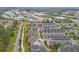 An aerial view of a residential neighborhood featuring townhomes and condos near offices and green spaces at 392 Concord St, Alpharetta, GA 30009