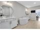 This bathroom features a modern tub, double sinks, white cabinets, and modern fixtures at 392 Concord St, Alpharetta, GA 30009