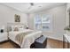 This bedroom features a window with plantation shutters, a ceiling fan, and neutral-toned walls at 392 Concord St, Alpharetta, GA 30009