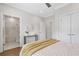 This bedroom features an ensuite bathroom, hardwood floors, and neutral-toned walls at 392 Concord St, Alpharetta, GA 30009